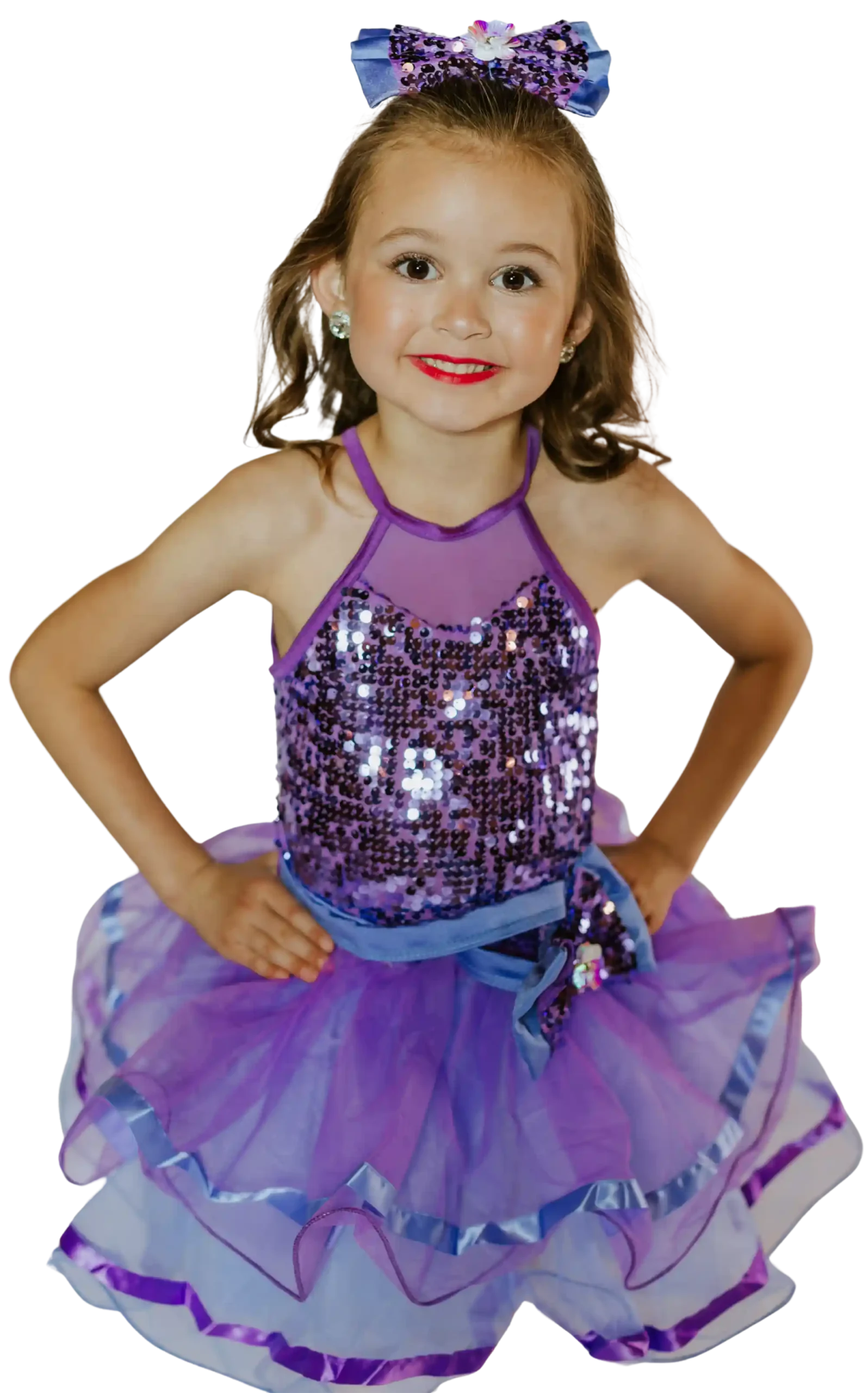 Little girl wearing a purple dance costume at Revolution School of Dance
