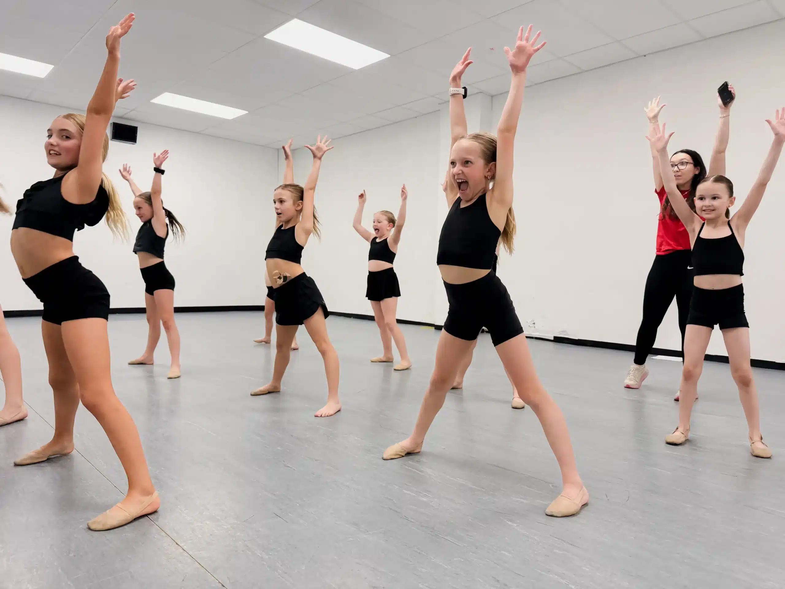 Kids dance class energetic arm raise
