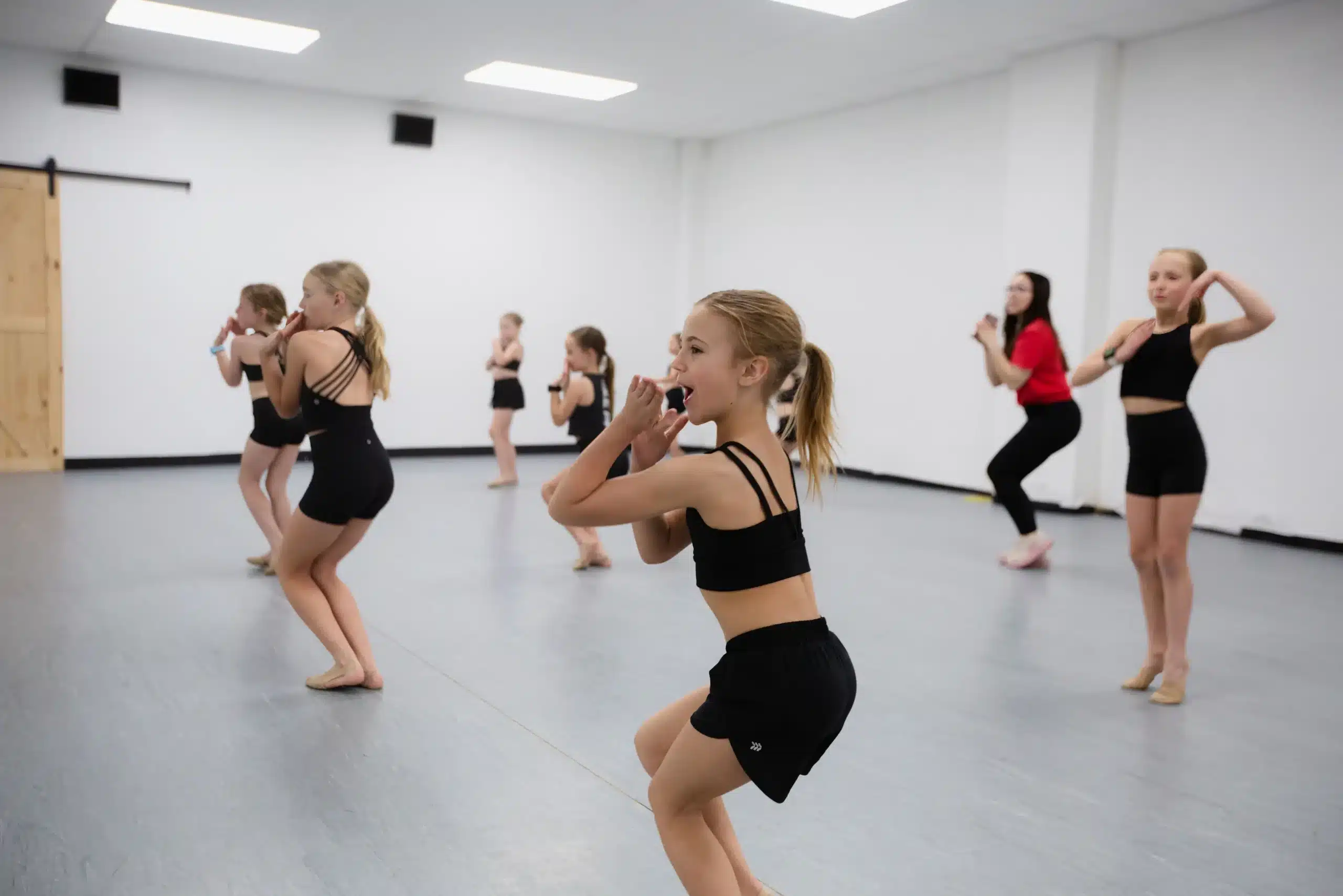 Kids dance class squat choreography practice