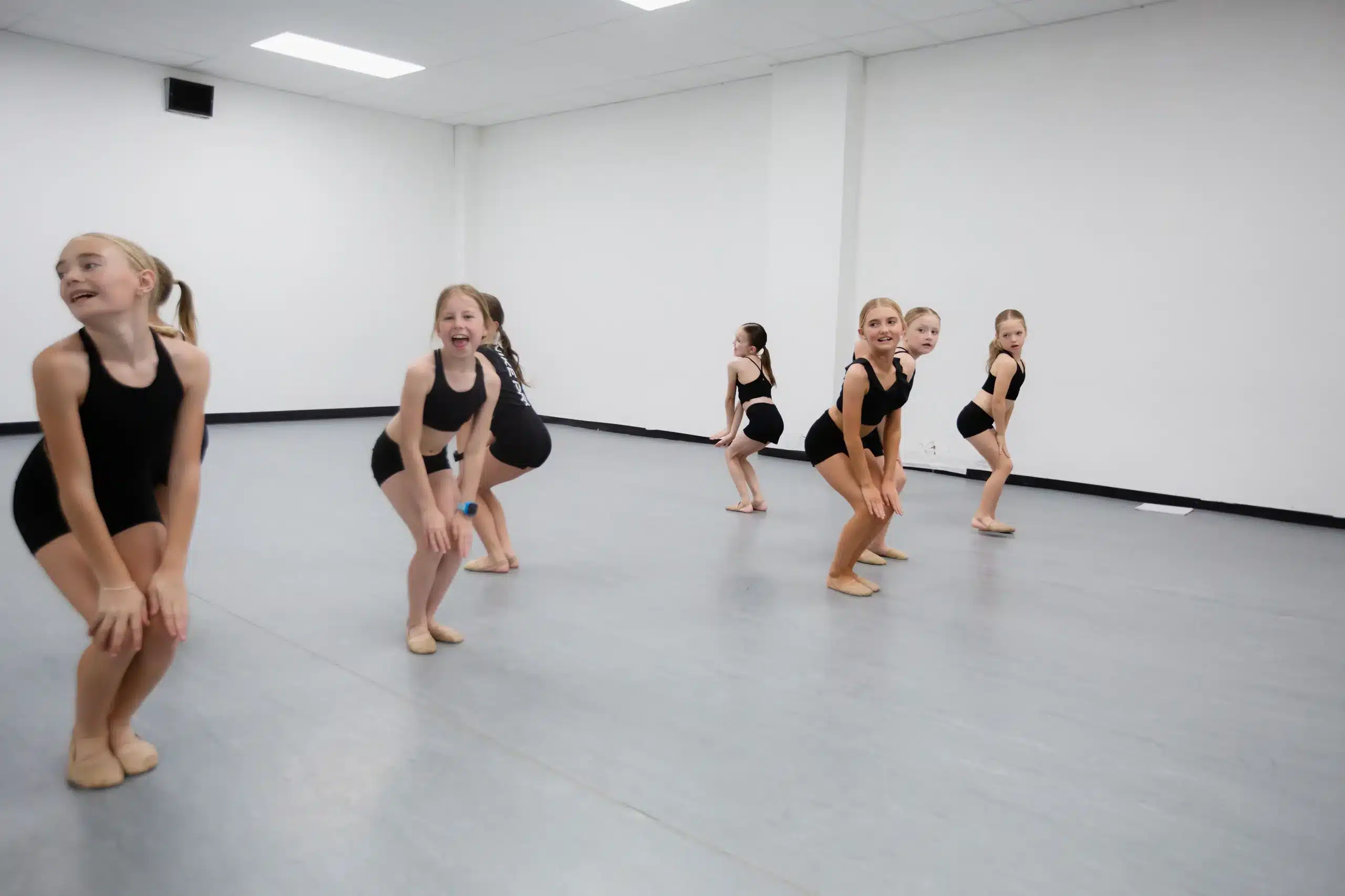 Kids dance class squat line practice